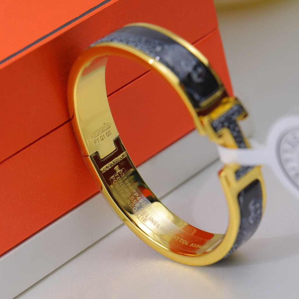 18K Hermes Guepards Clic Clac Bracelet